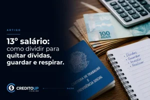 Notas de 100 reais, moedas e Carteira de Trabalho com 13º salário