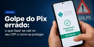 Mão segurando celular com app Pix mostrando 'Pagamento realizado' e golpe do Pix